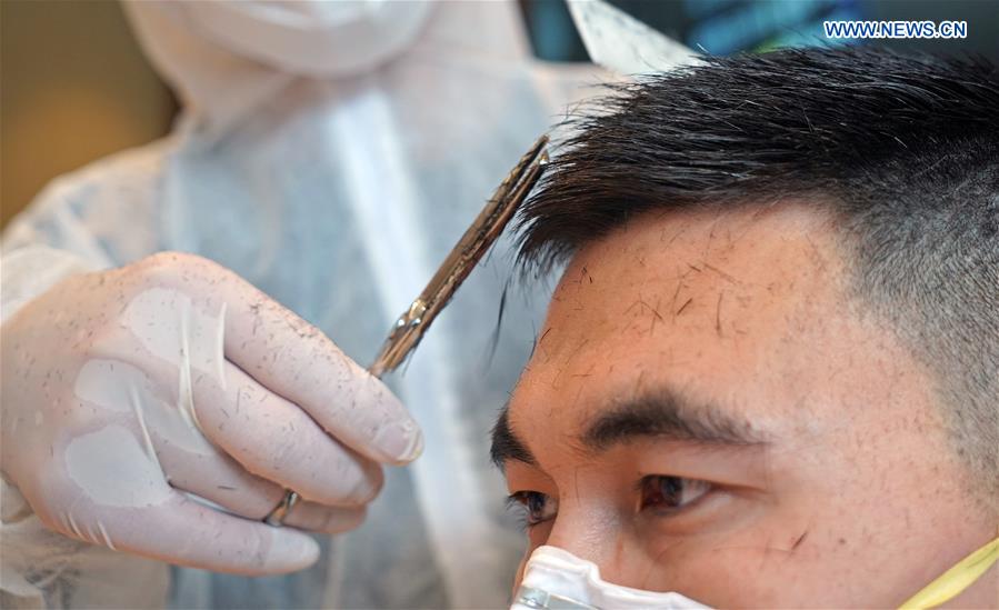 CHINA-HUBEI-WUHAN-LONGTAITOU DAY-MEDICAL STAFF-HAIRCUT (CN)