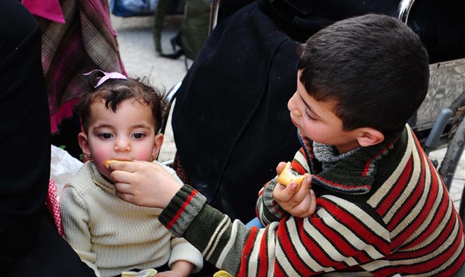 Civilians evacuate Douma district in Damascus' Eastern Ghouta